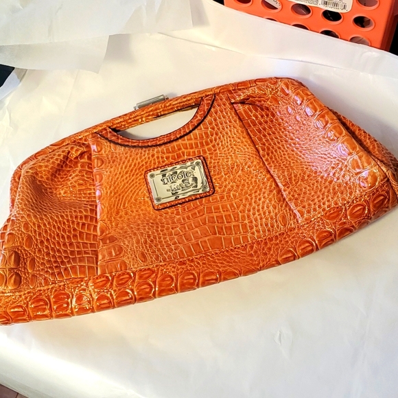 Nicole Miller Handbags - Nicole Miller Stylish Orange Crocodile clutch